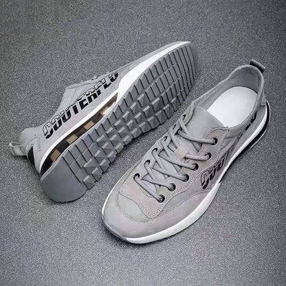 N007-Gris es una zapatilla deportiva perfecta para todos los niveles de entrenamiento. Cuenta con una cámara de aire para una amortiguación óptima y reducir el impacto en las articulaciones, especialmente en las rodillas, reduciendo el riesgo de lesiones. Está fabricada con un recubrimiento de lona y cuero sintético para ser resistente, transpirable y absorbente al sudor, y una suela dentada para obtener la mejor tracción.  Cordones de ajuste para mayor ajuste. 